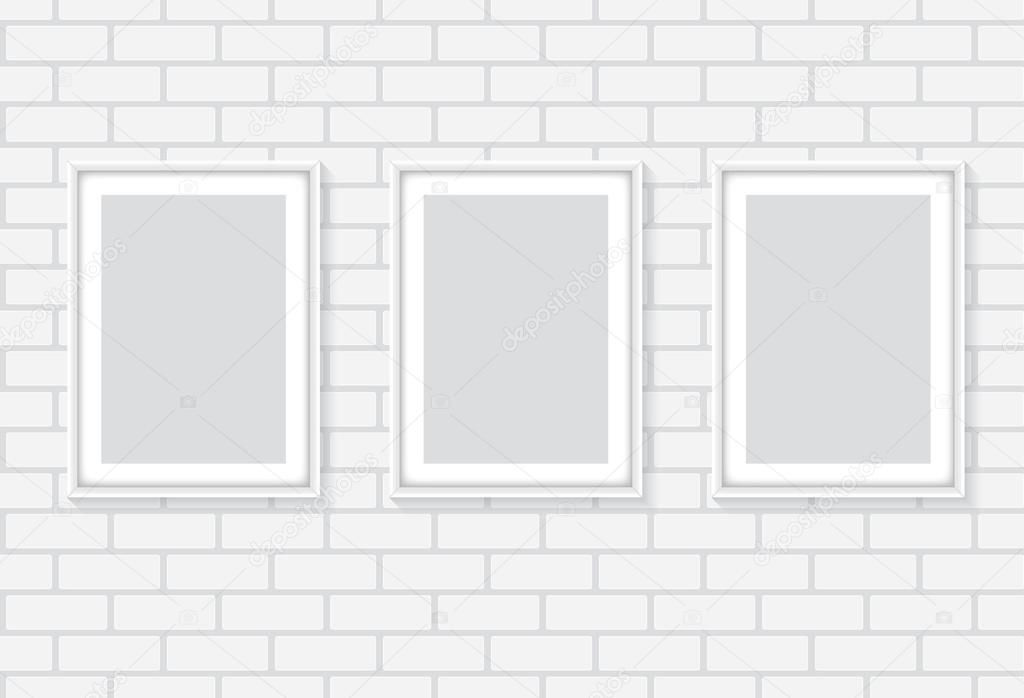 White brick wall with frames