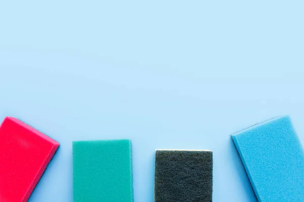 Multicolored Sponges Cleaning Blue Background Space Text — Foto de Stock