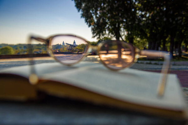 cannon and church through the glasses in the morning in Ukraine before the russian aggression