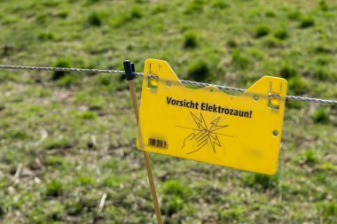 sign on danger at an electric fence
