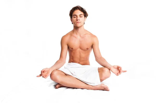 Jonge man mediteren Stockfoto