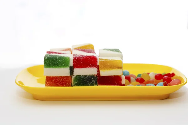 Sweet jelly on yellow plate — Stock Photo, Image