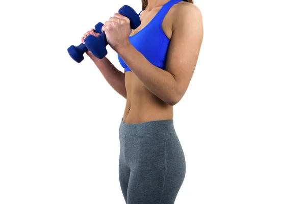 Toned woman's body with dumbbells — Stock Photo, Image