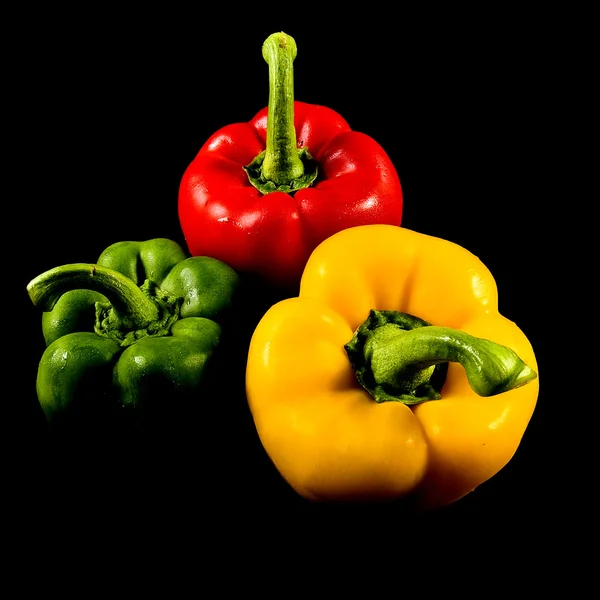 Peppers on dark background — Stock Photo, Image