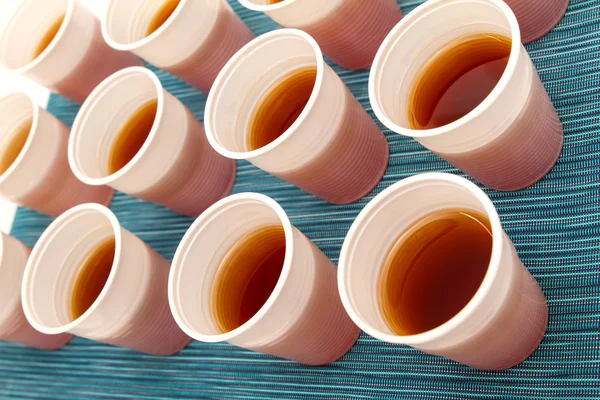 Disposable cups with tea — Stock Photo, Image