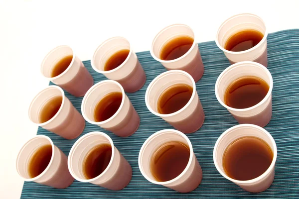 Disposable cups with tea — Stock Photo, Image