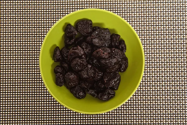 Prunes on a texture background — Stock Photo, Image