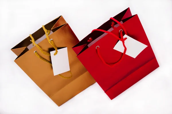 A gold and a red gift bag — Stock Photo, Image