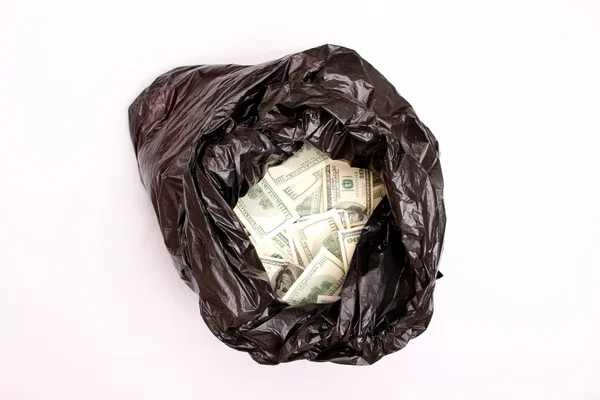 Rubbish bag with dollars — Stock Photo, Image