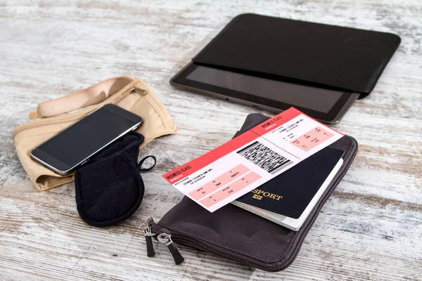 Airline ticket, passport and electronics — Stock Photo, Image