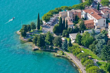 Panoramic view of the Garda Lake from the top of the hill clipart