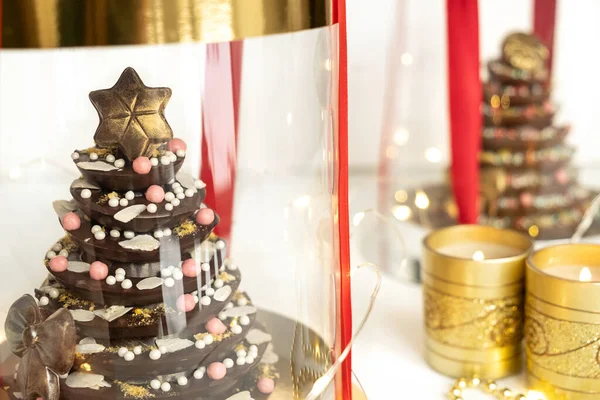 DIY chocolate Christmas or New Year trees in gift wrapping. Food christmas concept — Stockfoto