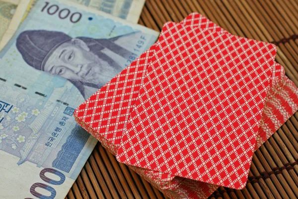 Pedaços de jogos com dinheiro asiático — Fotografia de Stock