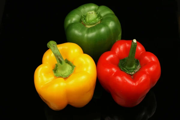 Pepper on a black background — Stock Photo, Image