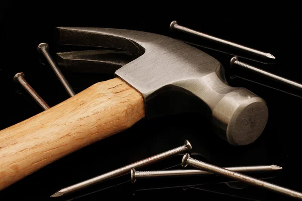 Hammer And Nails On A Black Background — Stock Photo, Image