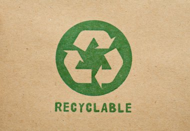Green recycle symbol on cardboard clipart