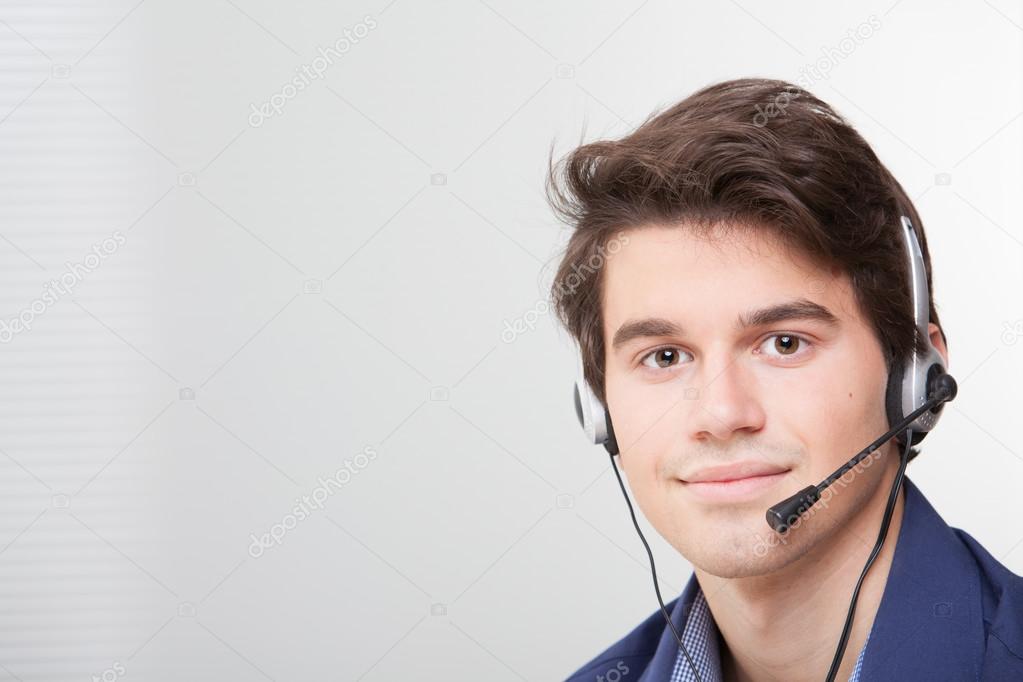 Portrait of a smiling call center employee wearing headset