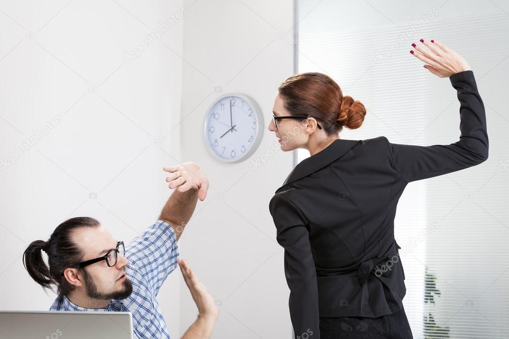 Angry businesswoman is slapping across the businessman's fac