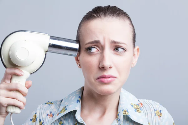 Woman with hair dryer — Stock Photo, Image