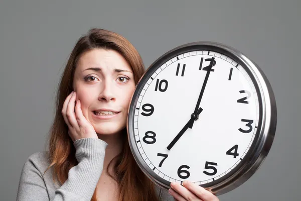 Young woman running out of time — Stock Photo, Image