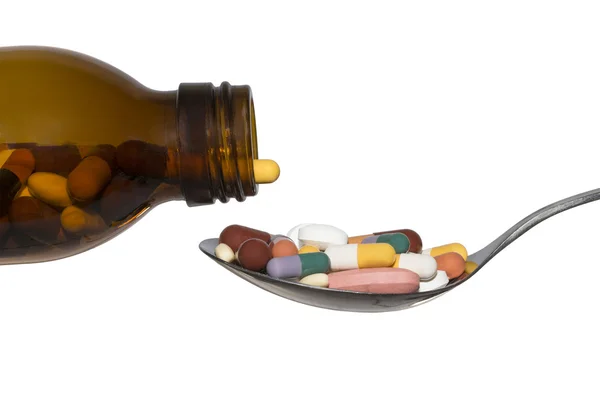 Bottle And Spoon With Many Pills Tablets Isolated On White — Stock Photo, Image