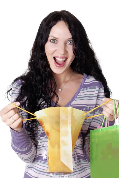 Encantadora joven morena sosteniendo coloridas bolsas de compras —  Fotos de Stock