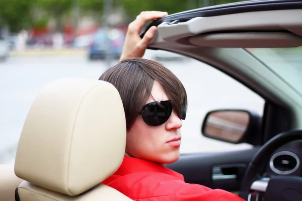 Young businessman sitting in a car. — Stock Photo, Image