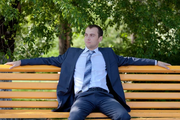 Young businessman is out of office in a field — Stock Photo, Image