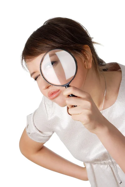 Charming young woman with magnifying glass — Stock Photo, Image