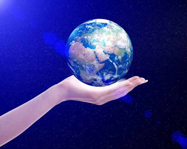 Planet earth in woman's hand — Stock Photo, Image