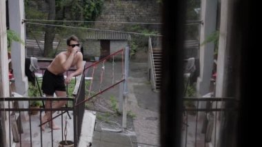 man sunbathing on the balcony
