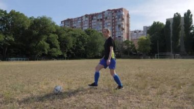 soccer player girl warming up on the grass field