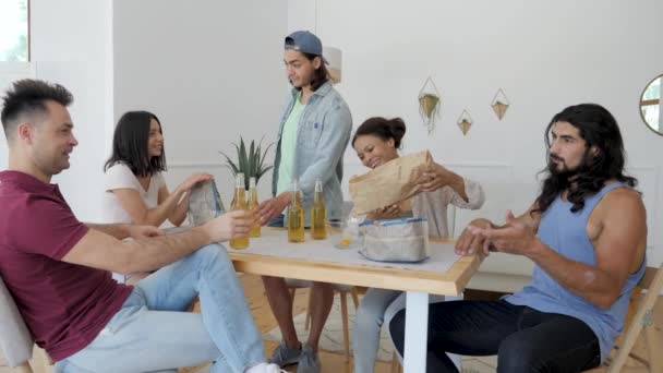 Guy Surrounded Friends Opens Bottle Beer Girls Pour Chips Bowl — 图库视频影像