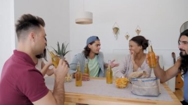 a group of friends sitting at a table chatting