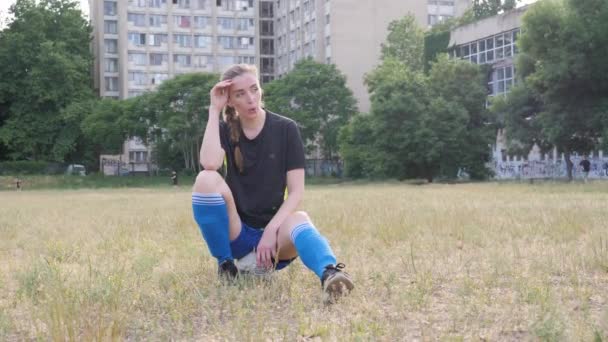 Girl Sits Ball Exhales Looks Camera — Video Stock