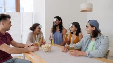 the company is playing leaflets on their foreheads in a game called who am I