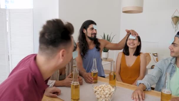 Guy Holds Leaf Forehead Girl Playing Game Guess Who Lets — Stok video
