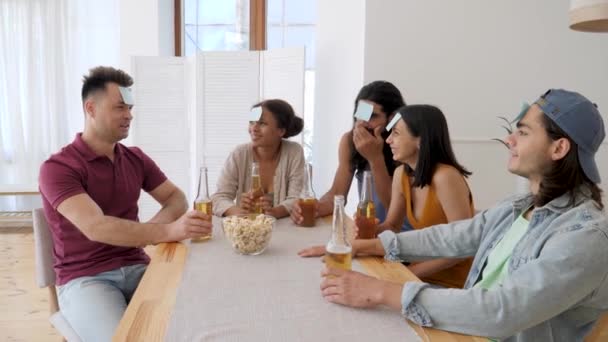 Multiethnic Group Friends Playing Game Who Leaves Foreheads — Stock Video