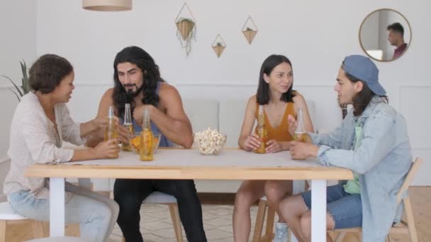 Group Friends Sitting Table Drinking Beer Guy Comes Checks Bottles — Stock Video