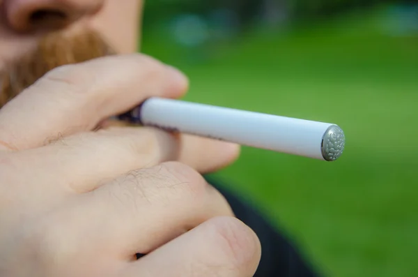 Smoking an electronic cigarette — Stock Photo, Image