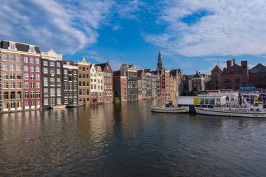 Amsterdam, Netherlands - 21 June 2022: Old Historical Houses At The Canal Around Damrak Amsterdam