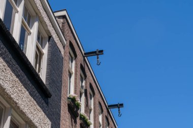 Traditional Amsterdam house with a hook on a beam to lift furniture during a move