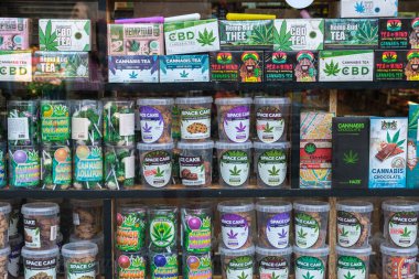Amsterdam, Netherlands - 21 June 2022: Many Cannabis products behind the window of a dutch coffee shop
