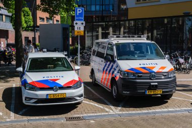 Amsterdam, The Netherlands - 22 June 2022: two police vehicules are parked