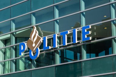 Amsterdam, The Netherlands - 22 June 2022: Amsterdam Police logo on the facade of a police building
