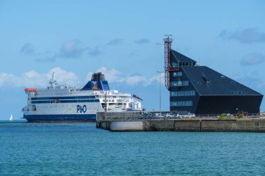 Calais, France - 26 June 2022: P&O Ferry going to England from Calais and former port authorities building