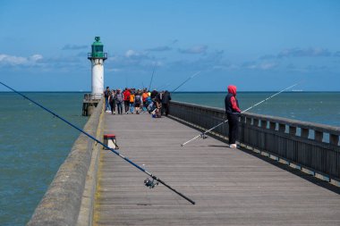 Calais, France - 26 June 2022: Fishermen on Calais Jetty