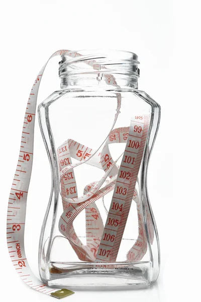 Glass with measuring tape — Stock Photo, Image