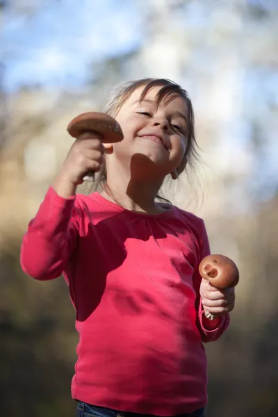 Little girl with mushrooms — Stock Photo, Image