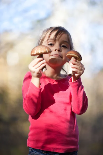 Little girl with mushrooms — Stock Photo, Image